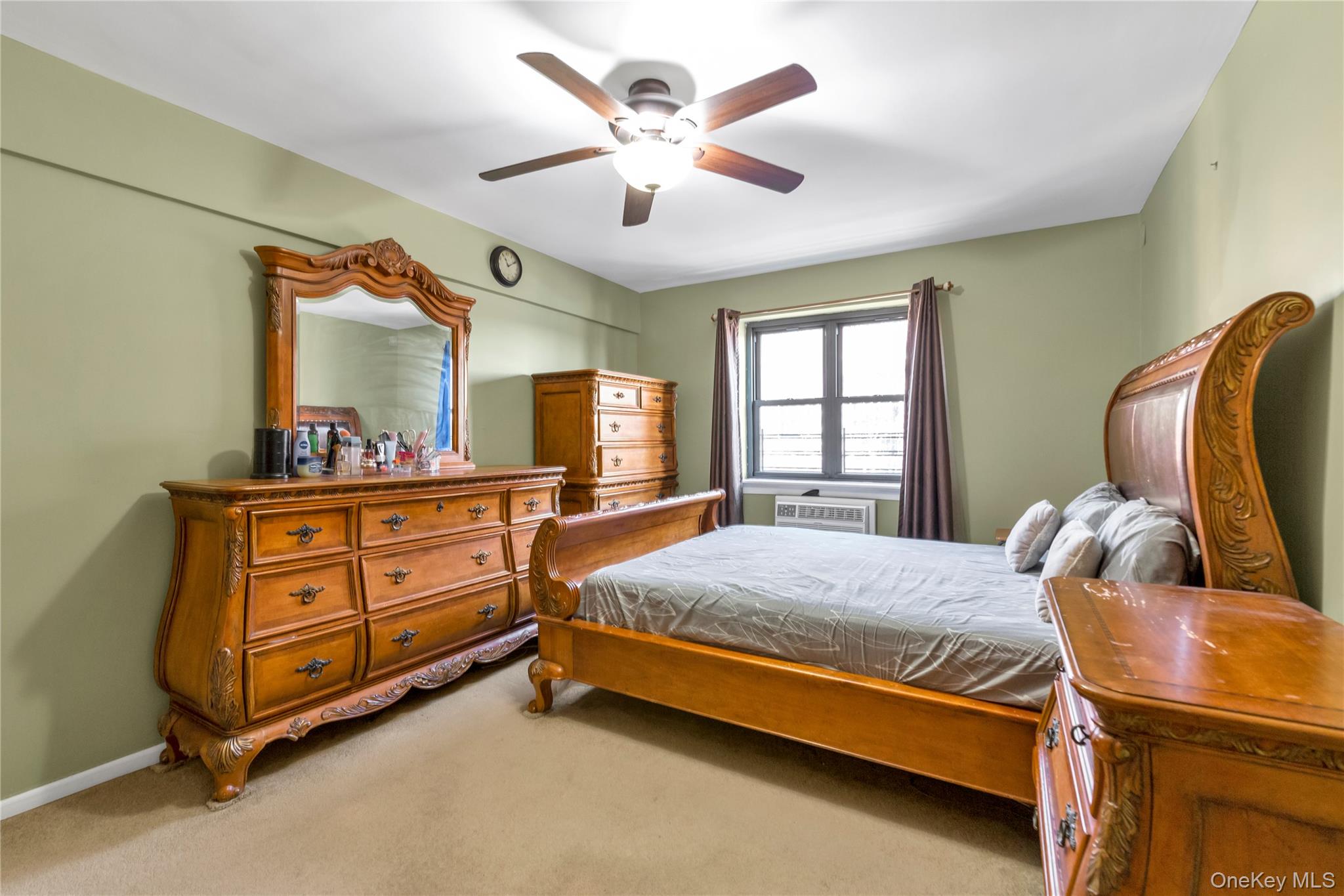 99-11 60th Avenue, Unit 5D Queens, NY 11368 - Photo 11 of 19 a bed room with a bed and window