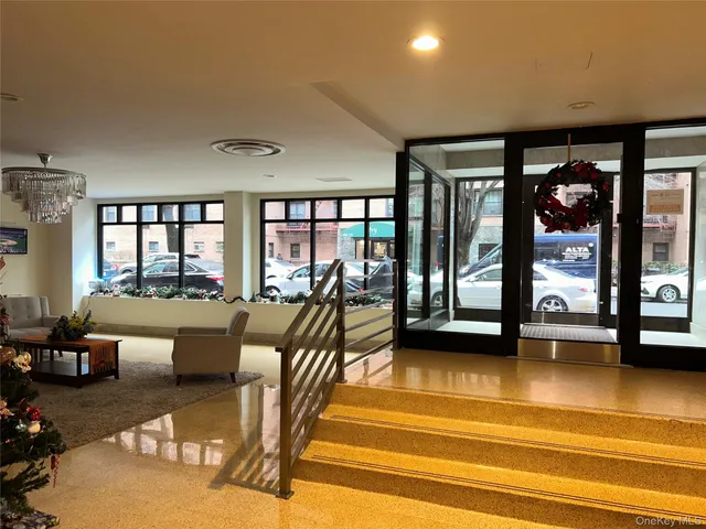 a view of a lobby with furniture and floor to ceiling window
