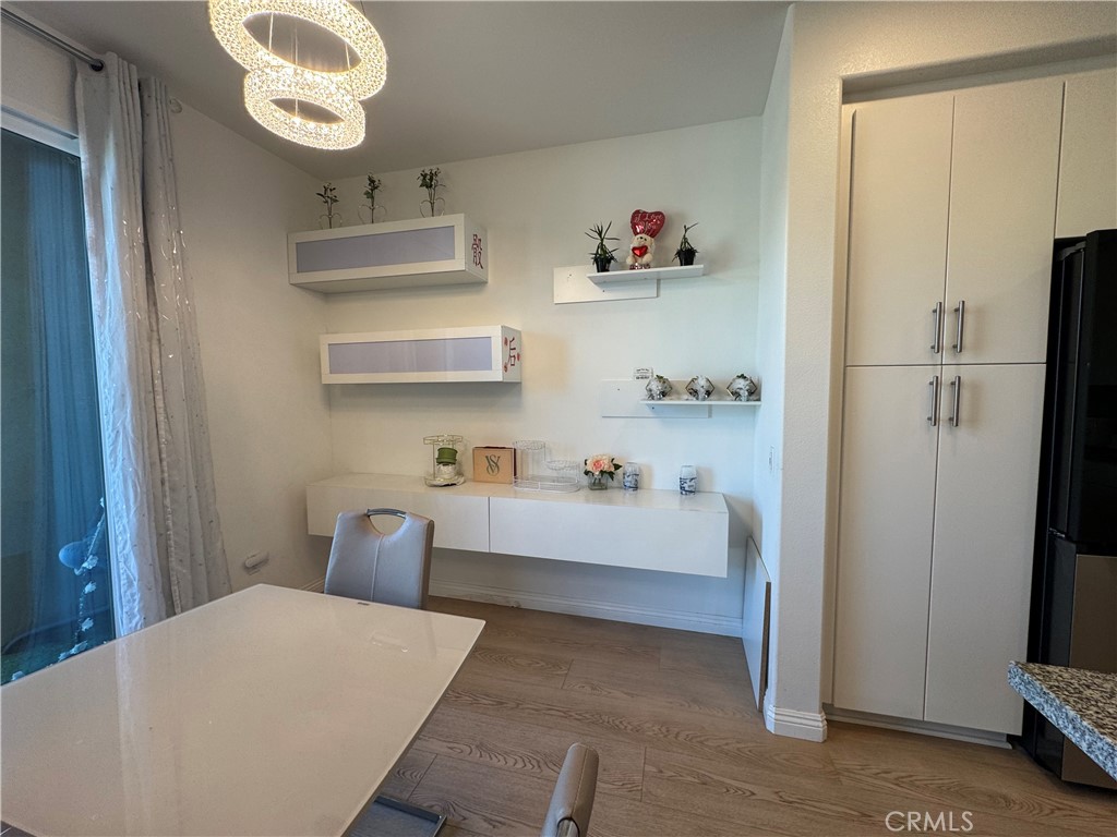 18632 Rorimer Street La Puente, CA 91744 - Photo 11 of 30 a bedroom with a bed and a chandelier