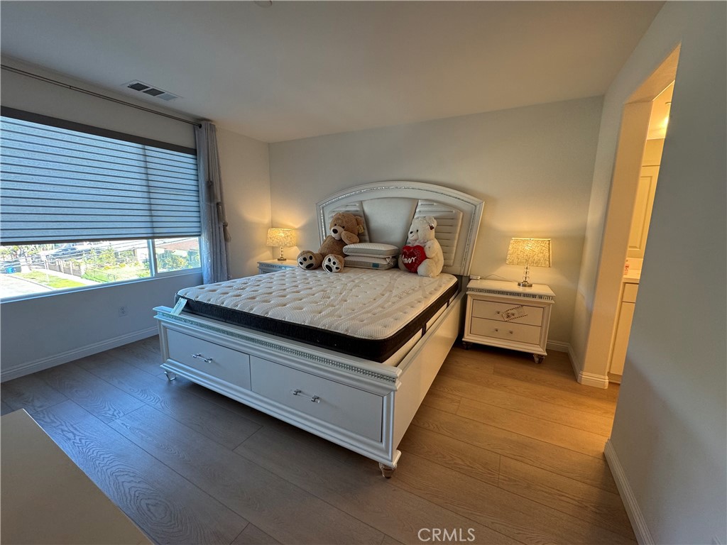 18632 Rorimer Street La Puente, CA 91744 - Photo 17 of 30 a bedroom with a bed and window