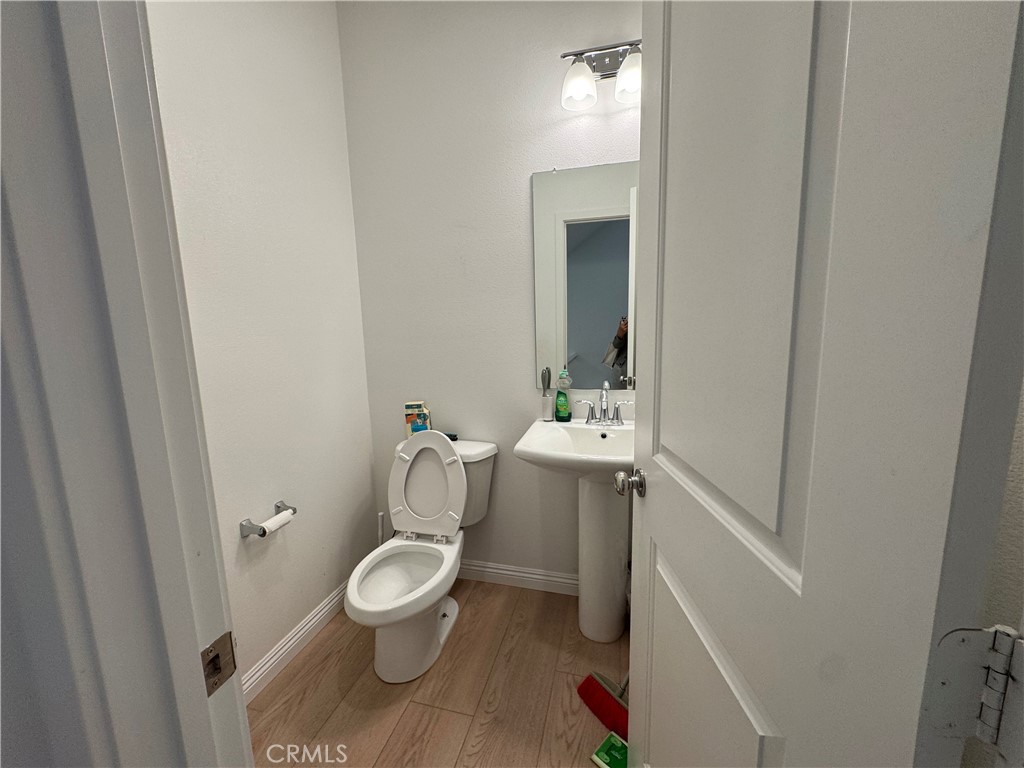 18632 Rorimer Street La Puente, CA 91744 - Photo 6 of 30 a bathroom with a toilet sink and mirror