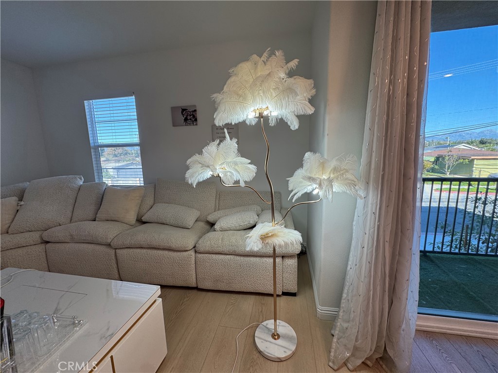 18632 Rorimer Street La Puente, CA 91744 - Photo 8 of 30 a living room with furniture wooden floor and a chandelier