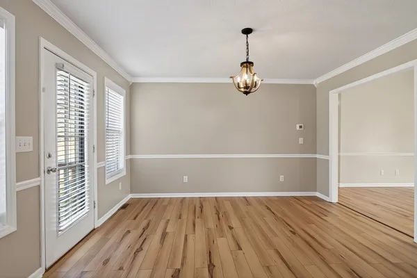 a kitchen with stainless steel appliances a stove a microwave oven cabinets and a counter space