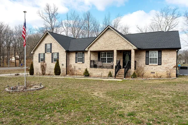 a front view of a house with a yard