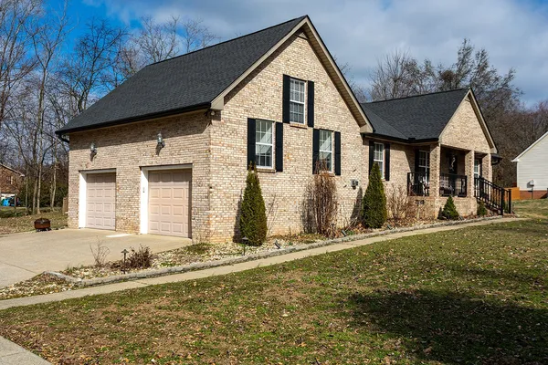 a front view of a house with garden