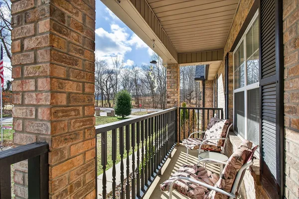 a view of balcony with furniture