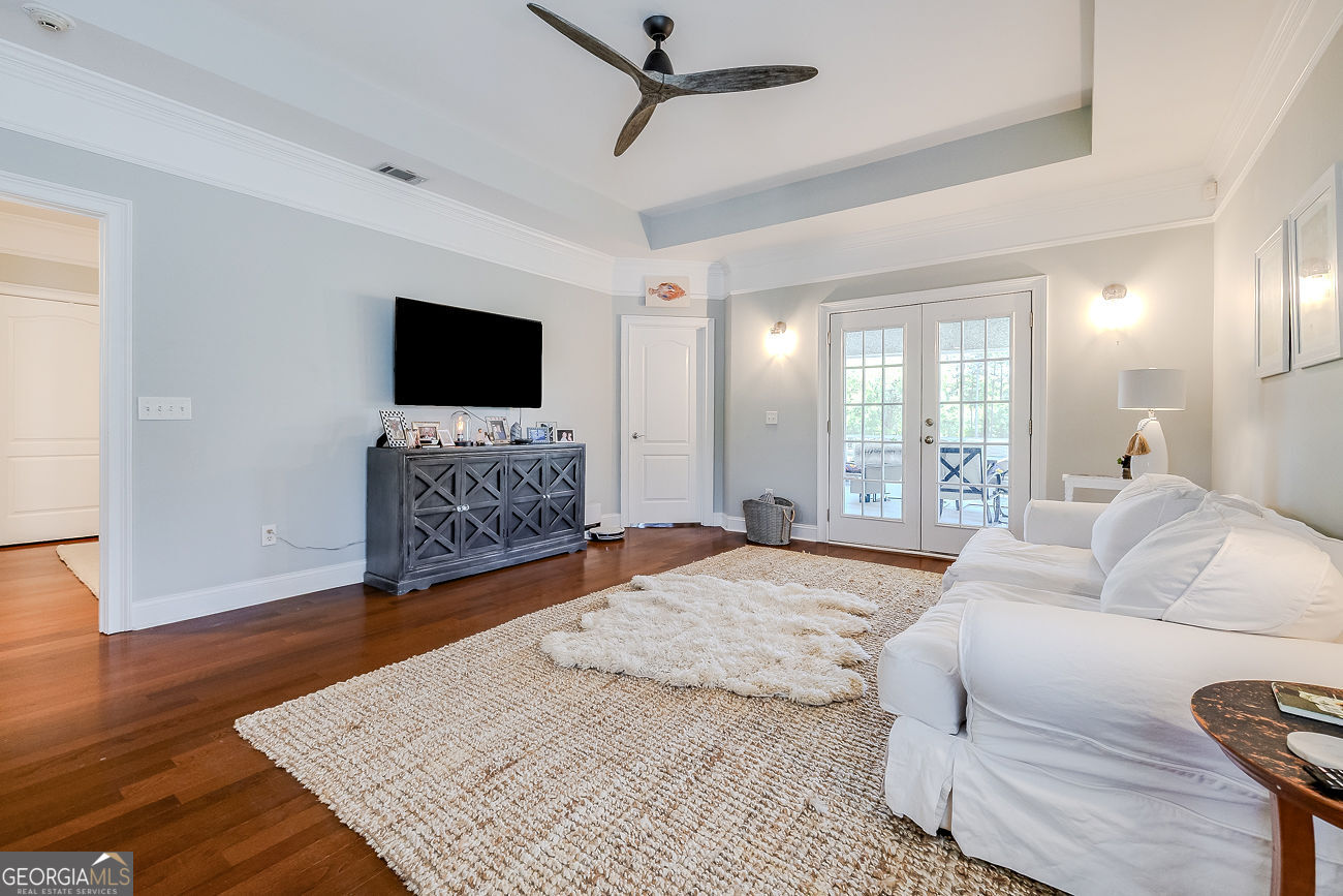 7272 Shellman Bluff Road Northeast, Unit 18 Townsend, GA 31331 - Photo 8 of 31 a spacious bedroom with a bed and a flat screen television