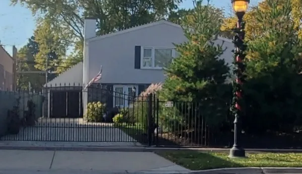 a front view of a house with garden