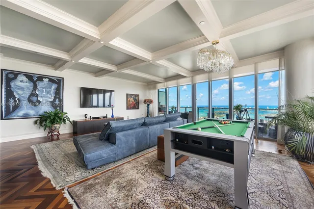 a room with lots of potted plants and glass door