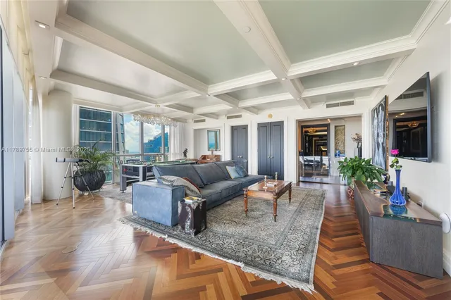 a large bedroom with a bed and large window