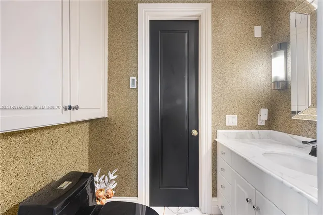 a living room with couches and wooden floor