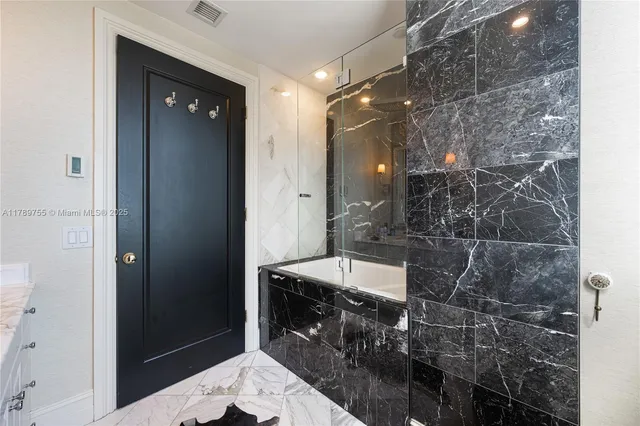 a view of a swimming pool with chairs