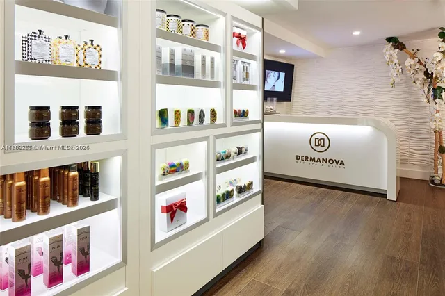 a living room with blue floor furniture and floor to ceiling windows