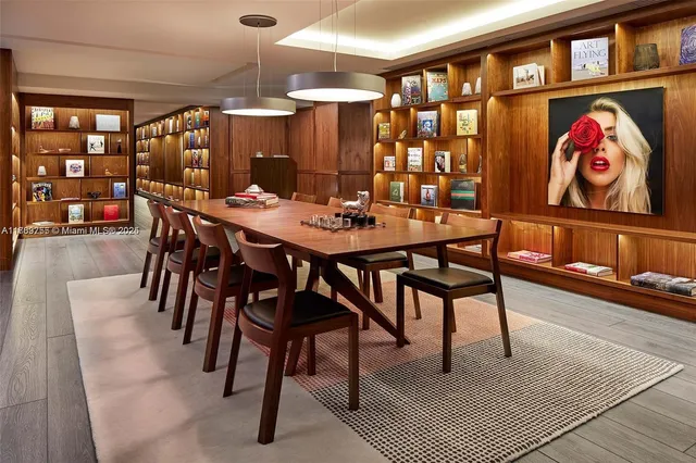 a living room with fireplace furniture and a chandelier