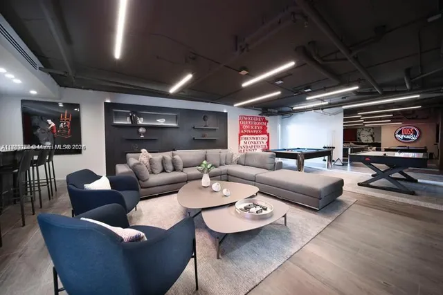a view of a living room and hall with wooden floor