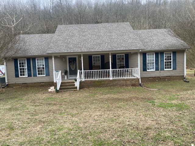 245 Loyd Road Pulaski, TN 38478 - Photo 16 of 20 a front view of a house with a garden