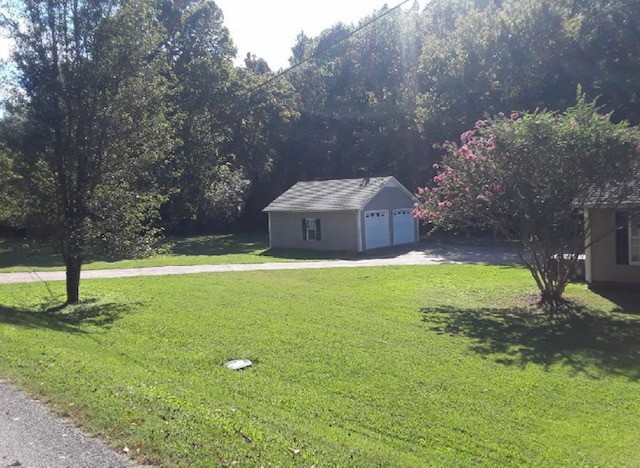 245 Loyd Road Pulaski, TN 38478 - Photo 3 of 20 a view of a garden with a fountain
