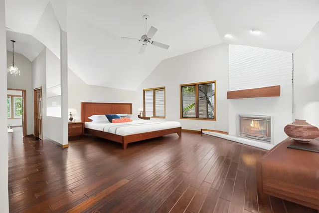 a bedroom with furniture and wooden floor