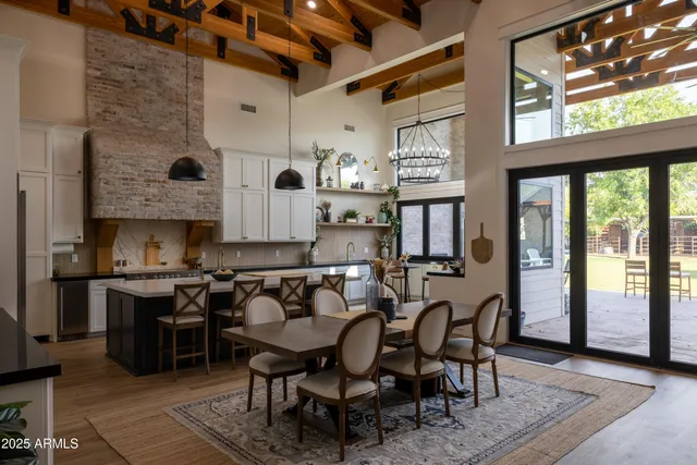 a kitchen with stainless steel appliances granite countertop a refrigerator and a stove