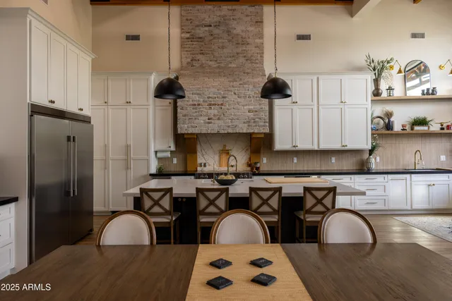 a bedroom with a large bed and a couch