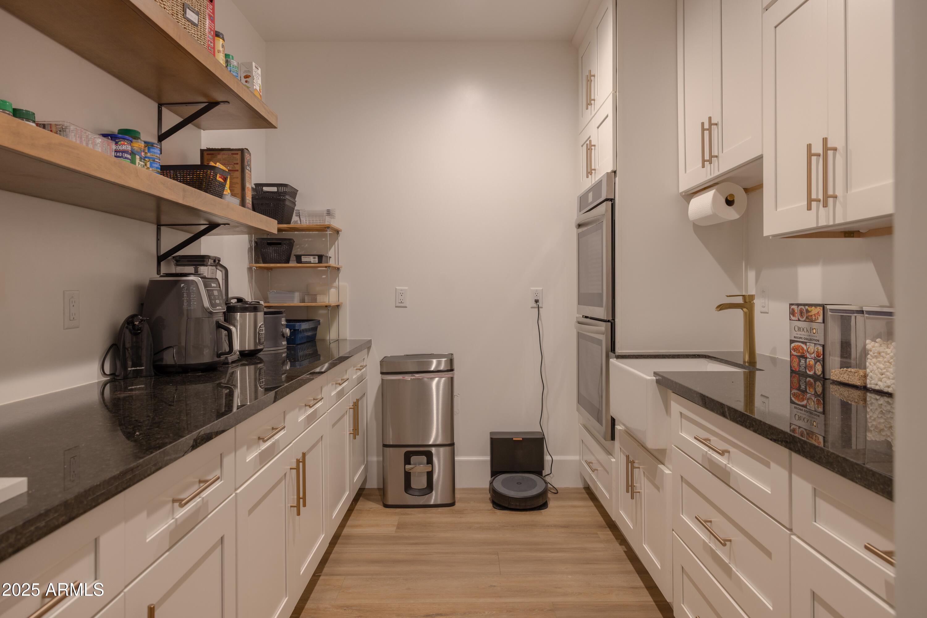 16322 East Fairview Street Gilbert, AZ 85295 - Photo 23 of 115 a kitchen with stainless steel appliances granite countertop a refrigerator and a stove