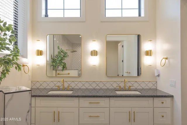 a kitchen with granite countertop wooden floors and refrigerator