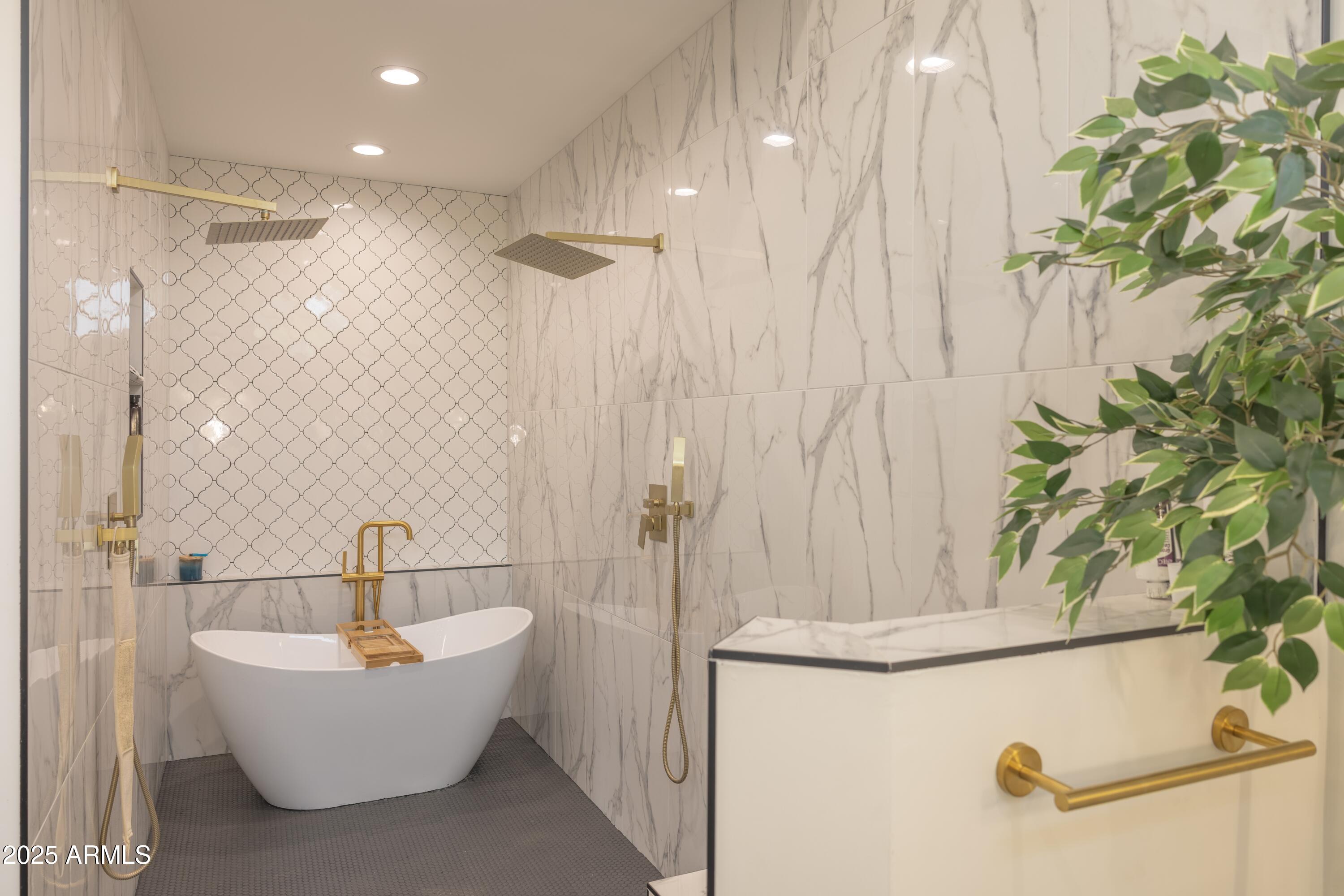 16322 East Fairview Street Gilbert, AZ 85295 - Photo 30 of 115 a bathroom with a bathtub and shower