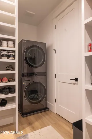 a living room with furniture a window and gym equipment