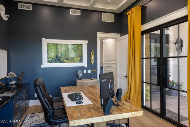 a view of a patio with table and chairs potted plants