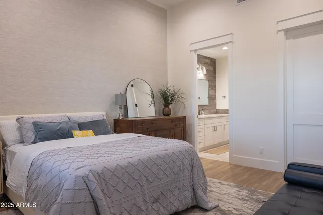 a view of a patio with table and chairs with wooden floor and fence