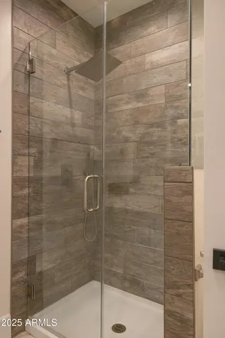 a view of house with swimming pool and sitting area