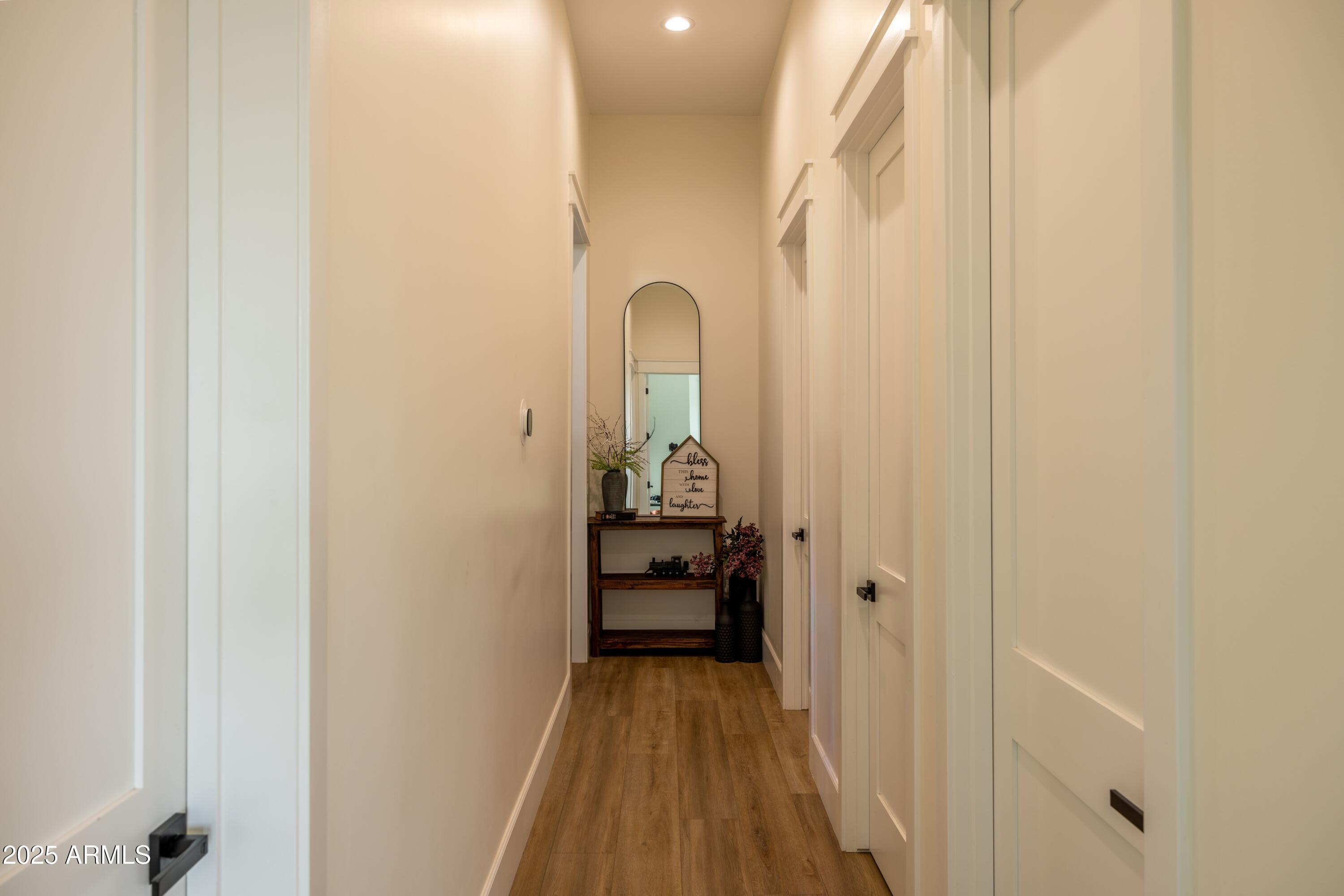 16322 East Fairview Street Gilbert, AZ 85295 - Photo 52 of 115 a view of a hallway with wooden floor and staircase