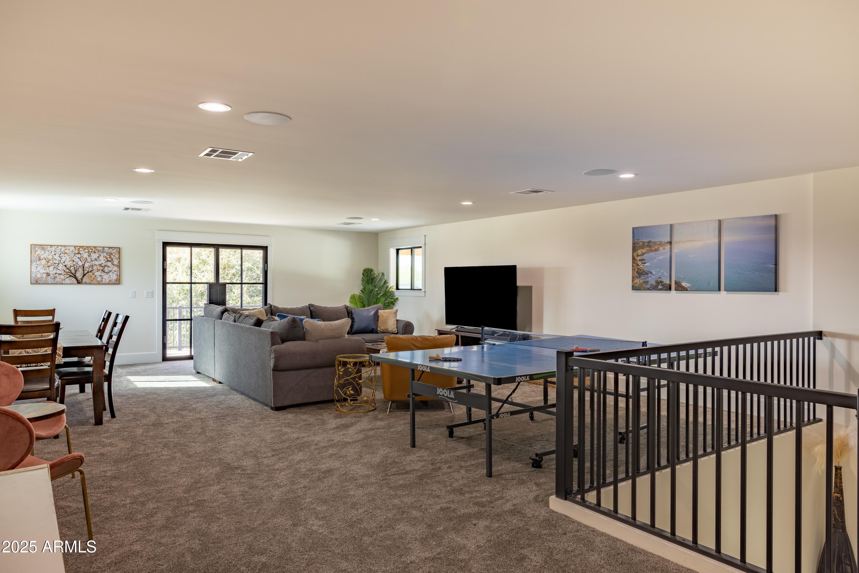 16322 East Fairview Street Gilbert, AZ 85295 - Photo 56 of 115 a living room with furniture and a flat screen tv