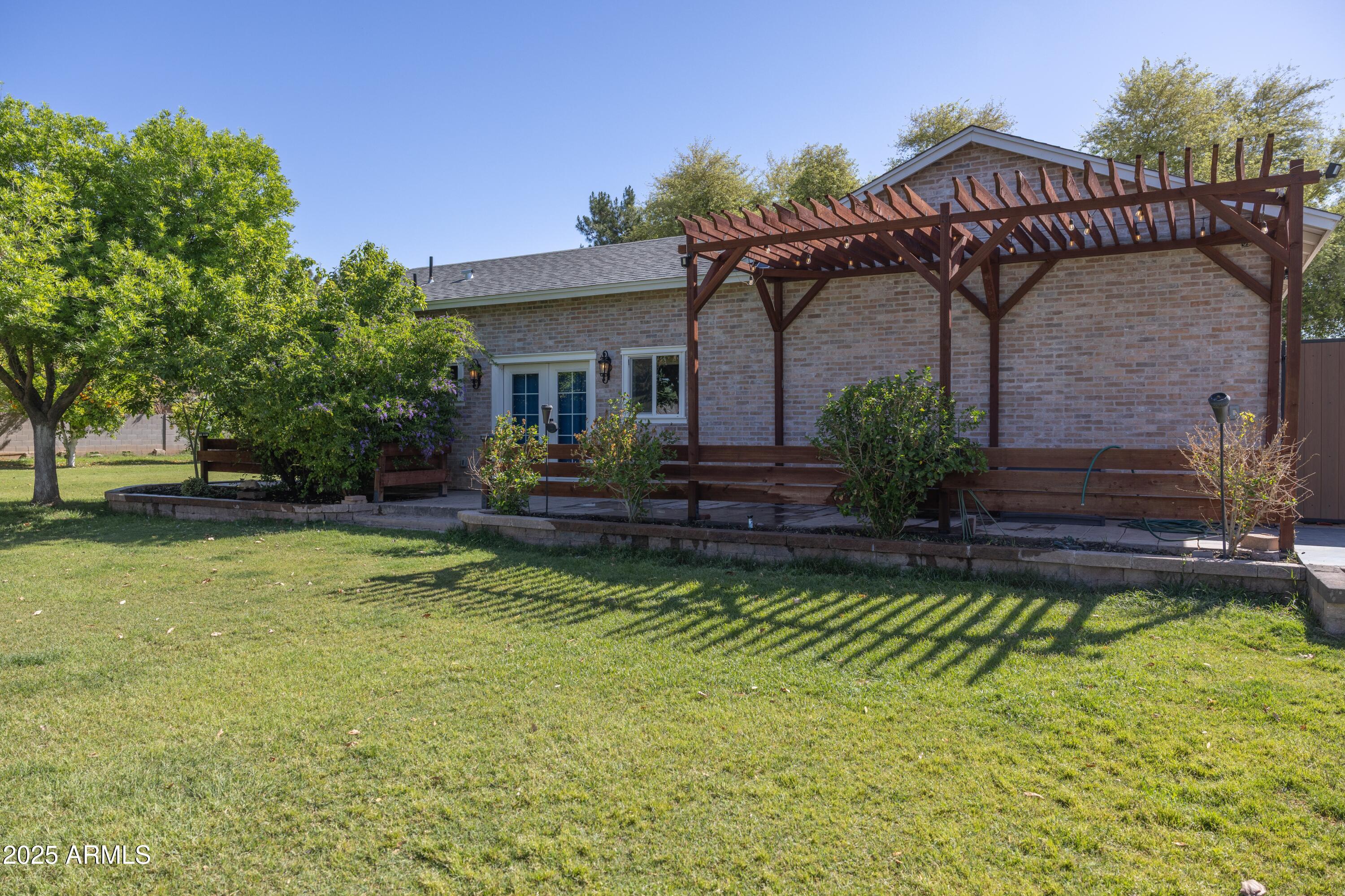 16322 East Fairview Street Gilbert, AZ 85295 - Photo 66 of 115 a front view of a house with a garden