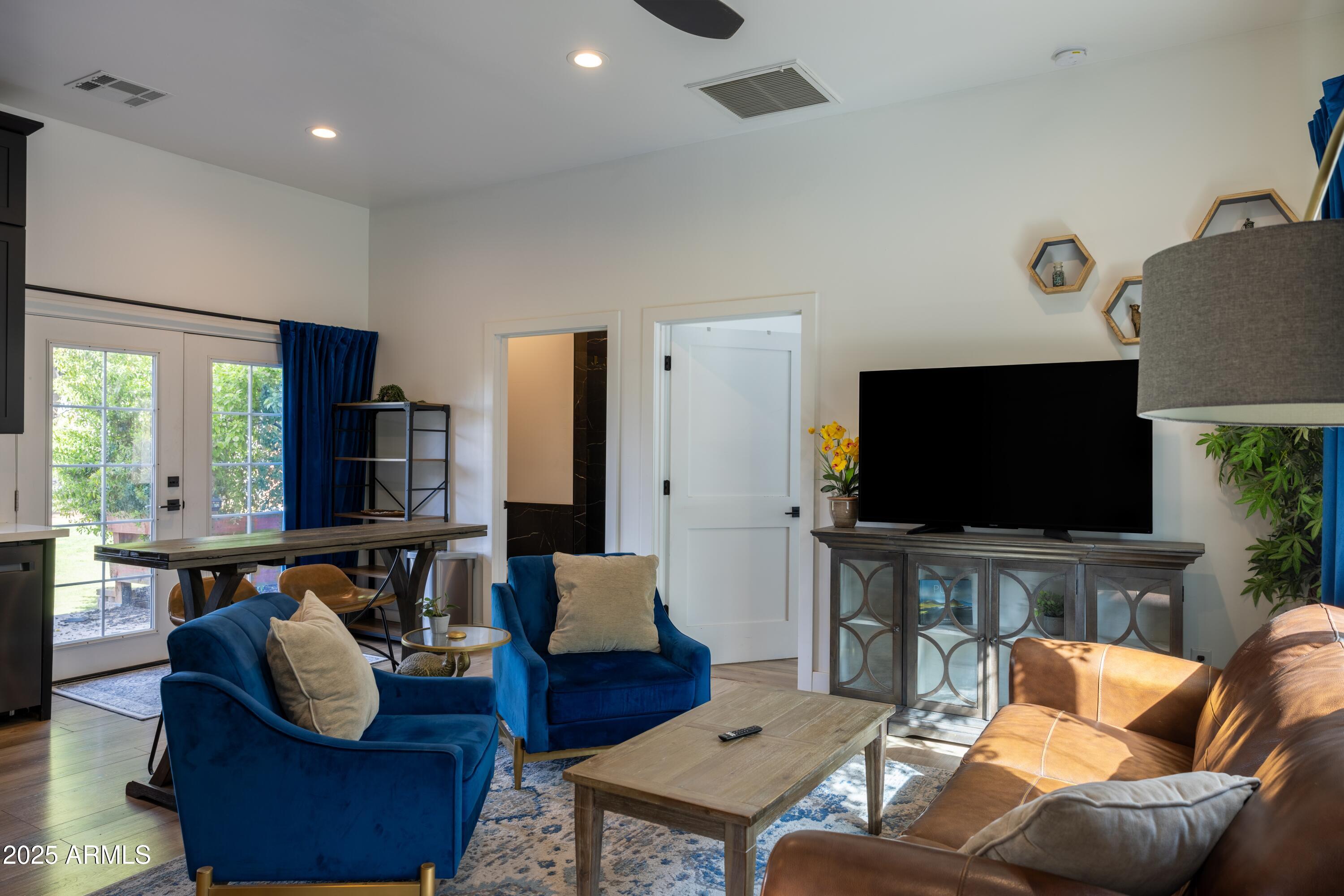 16322 East Fairview Street Gilbert, AZ 85295 - Photo 69 of 115 a living room with furniture and a flat screen tv