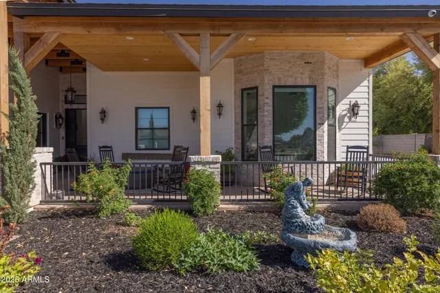 a kitchen with stainless steel appliances granite countertop a sink a stove and refrigerator