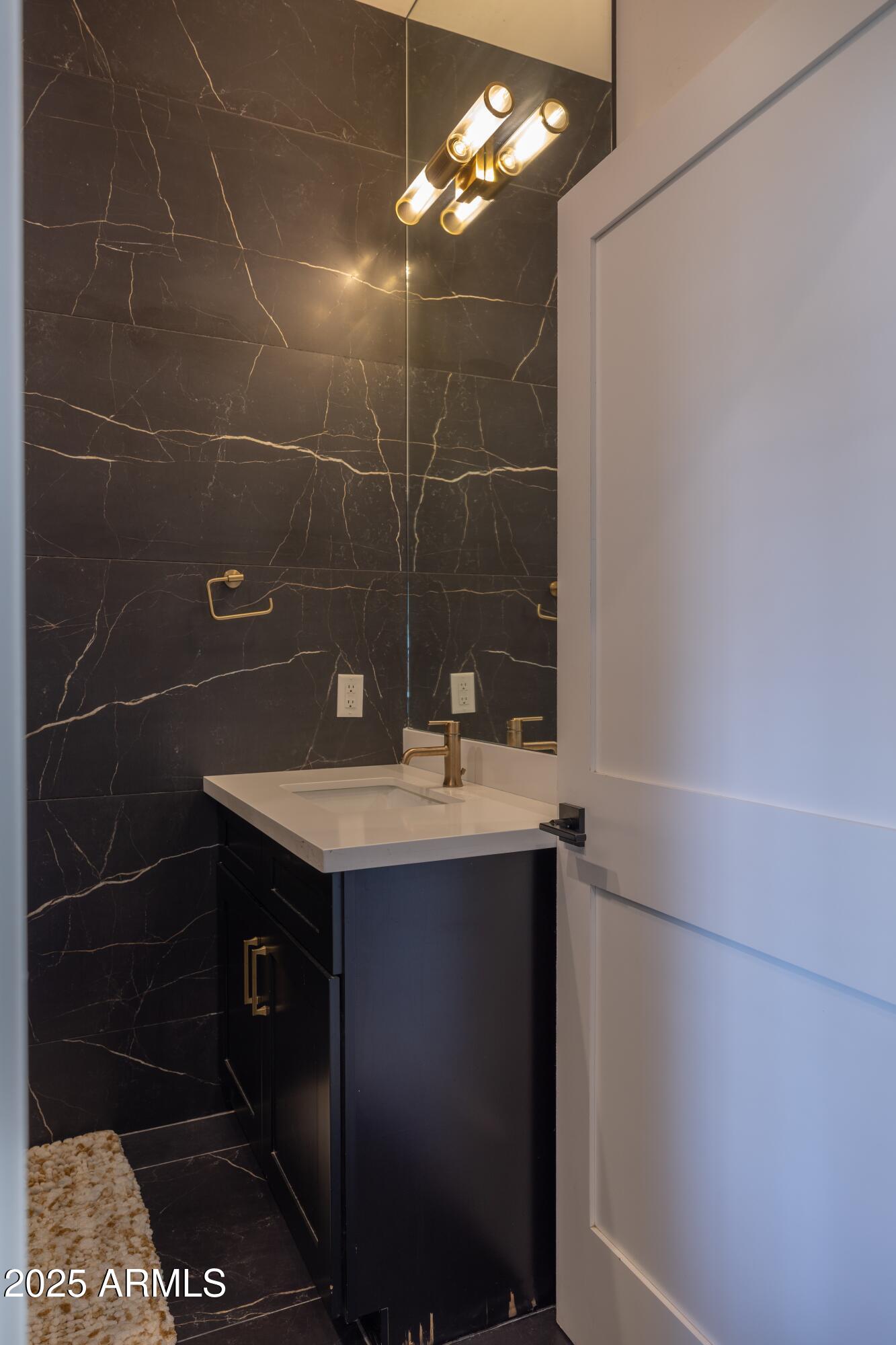 16322 East Fairview Street Gilbert, AZ 85295 - Photo 72 of 115 a bathroom with a sink a vanity and a mirror