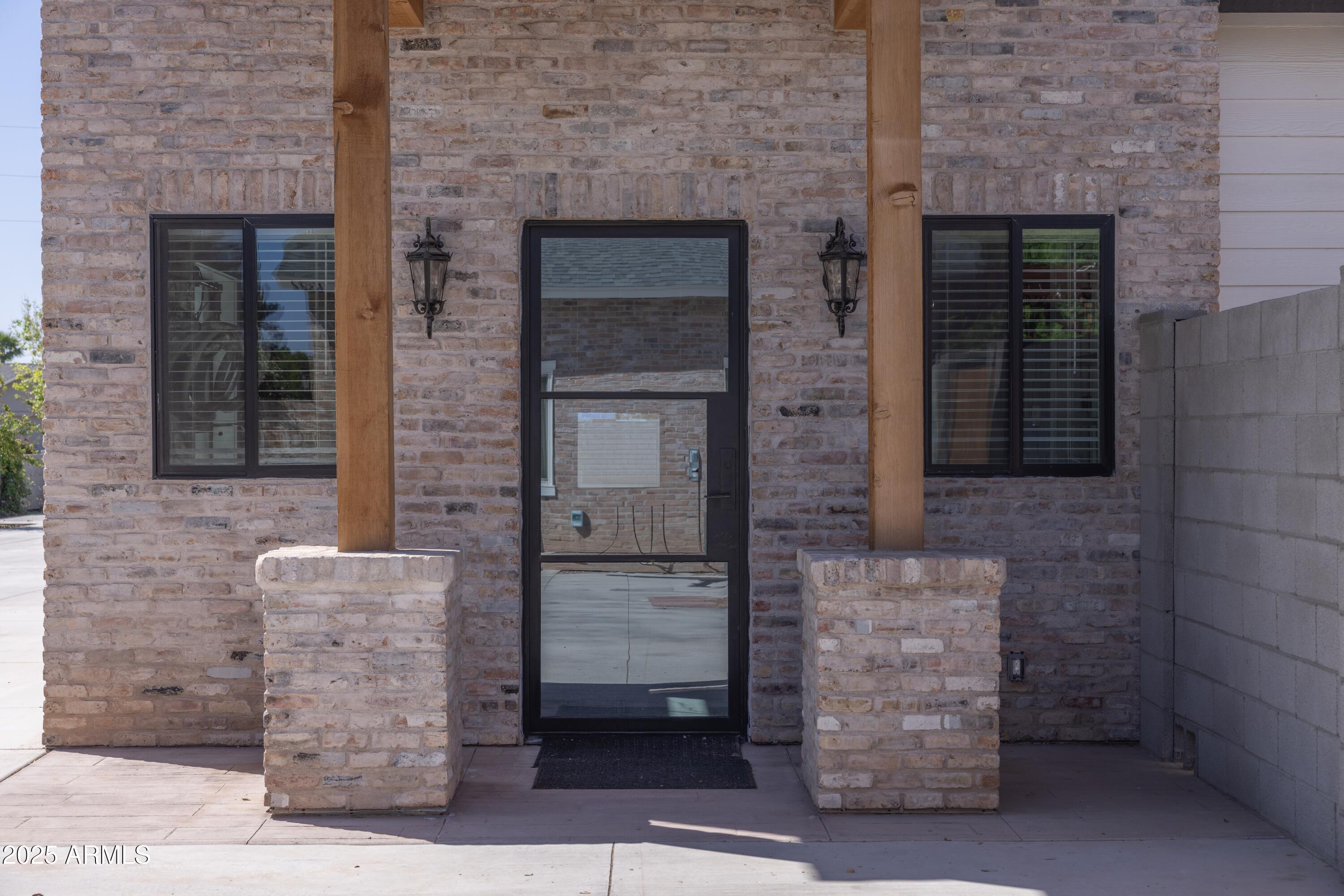 16322 East Fairview Street Gilbert, AZ 85295 - Photo 75 of 115 front view of a brick house with an outdoor space
