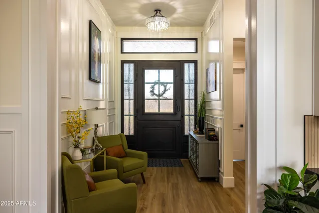 a lobby with furniture and floor to ceiling window