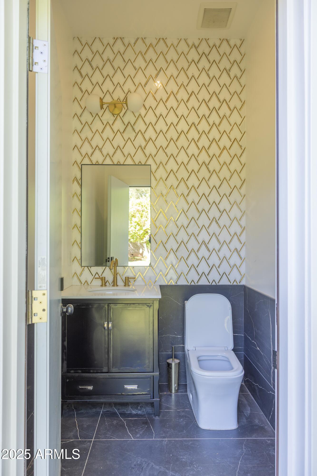 16322 East Fairview Street Gilbert, AZ 85295 - Photo 94 of 115 a bathroom with a toilet and a sink