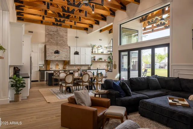 a view of a very nice looking dining room with a large window