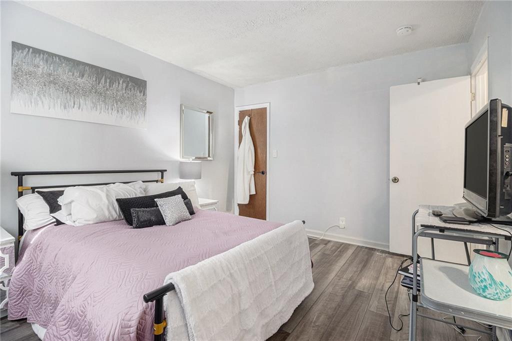 190 Kipling Way Riverdale, GA 30274 - Photo 11 of 22 a bedroom with a bed and a flat screen tv