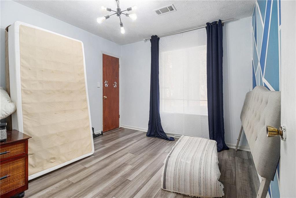 190 Kipling Way Riverdale, GA 30274 - Photo 17 of 22 a bedroom with a bed and a mirror