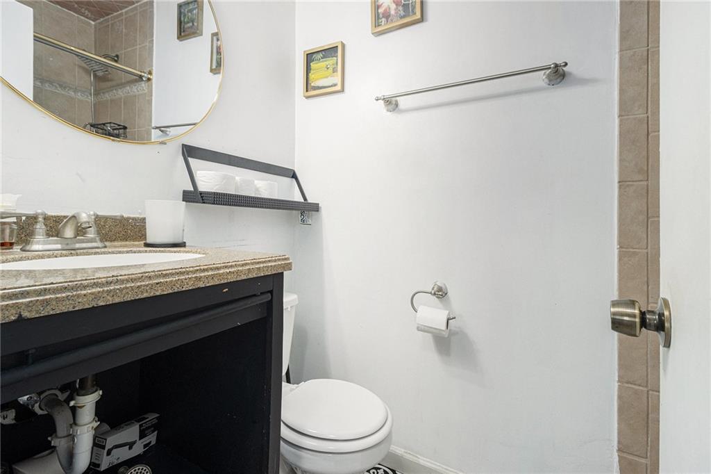 190 Kipling Way Riverdale, GA 30274 - Photo 18 of 22 a bathroom with a granite countertop sink toilet and shower