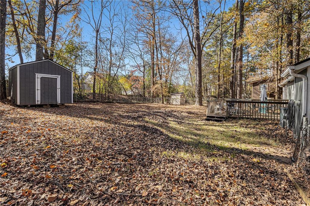 190 Kipling Way Riverdale, GA 30274 - Photo 21 of 22 a view of a backyard with large trees