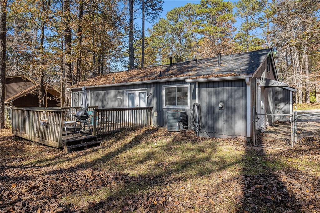 190 Kipling Way Riverdale, GA 30274 - Photo 22 of 22 a view of wooden house with a yard