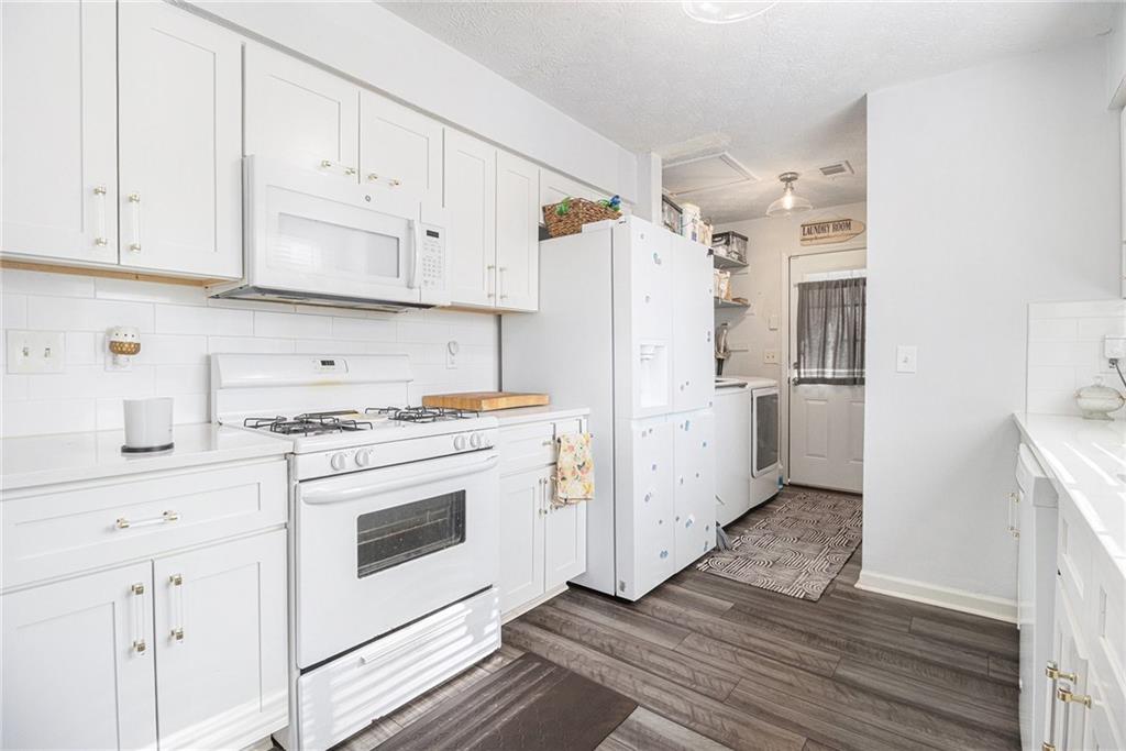 190 Kipling Way Riverdale, GA 30274 - Photo 8 of 22 a kitchen with white cabinets and white appliances