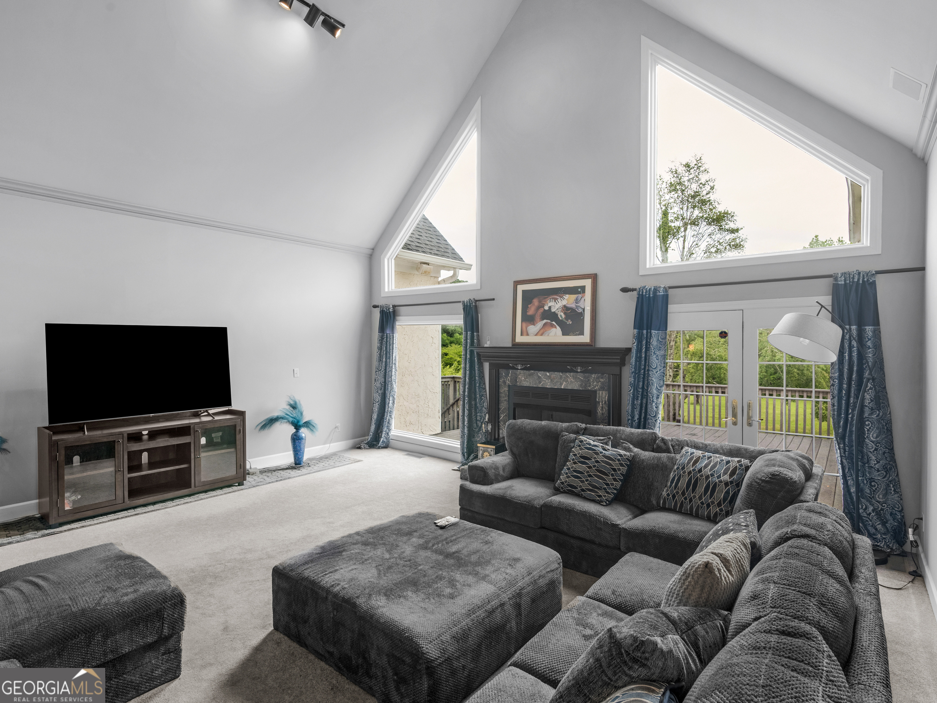 474 North Rover Road Williamson, GA 30292 - Photo 16 of 89 a living room with furniture and a flat screen tv