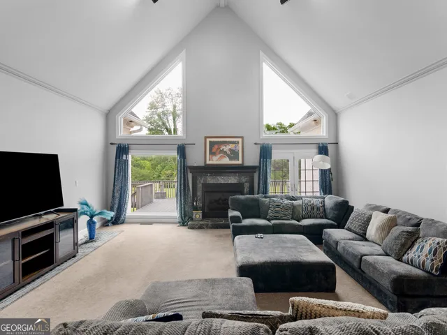 a bedroom with a bed and ceiling fan