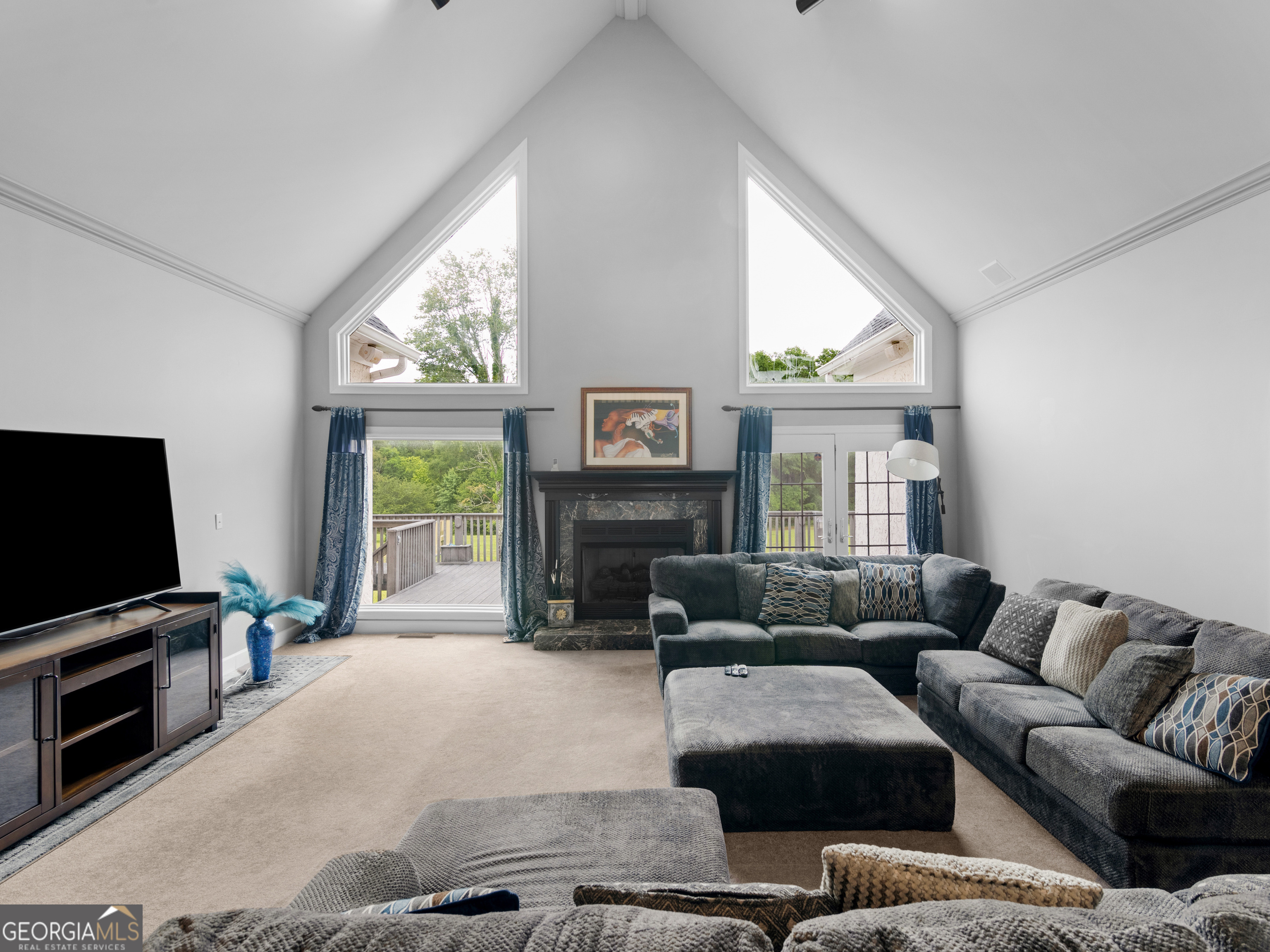 474 North Rover Road Williamson, GA 30292 - Photo 20 of 89 a living room with furniture and a flat screen tv
